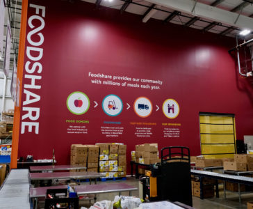 Foodshare's distribution center with messaging